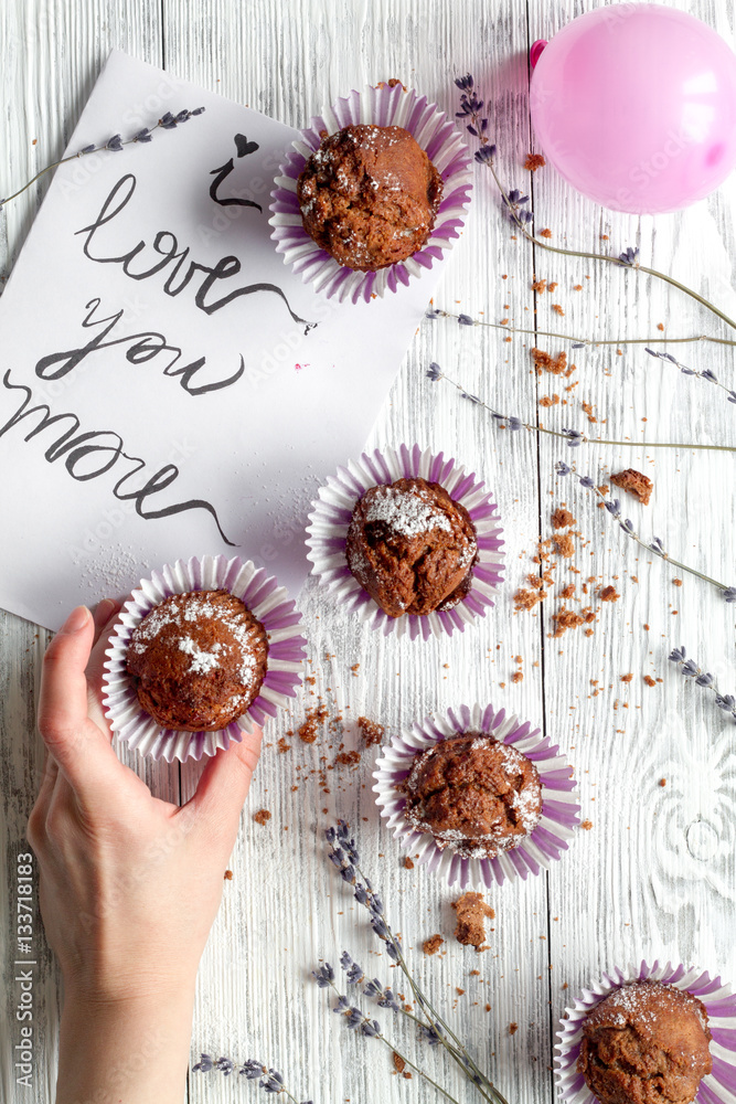 concept of Valentines Day cupcakes wooden background top view