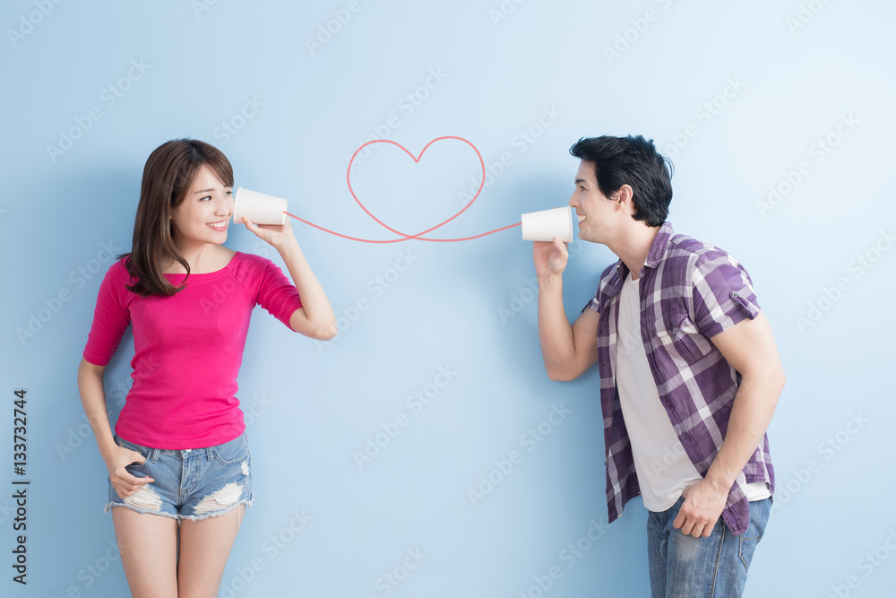 young couple with can phone