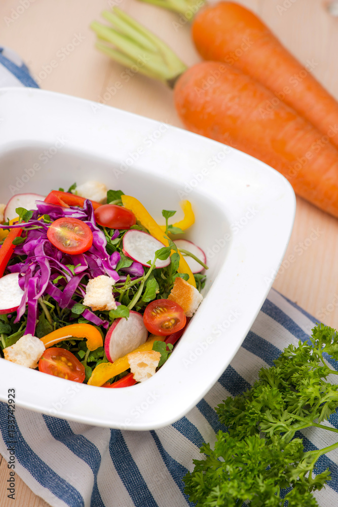 Homemade fresh green vegetable salad on table.