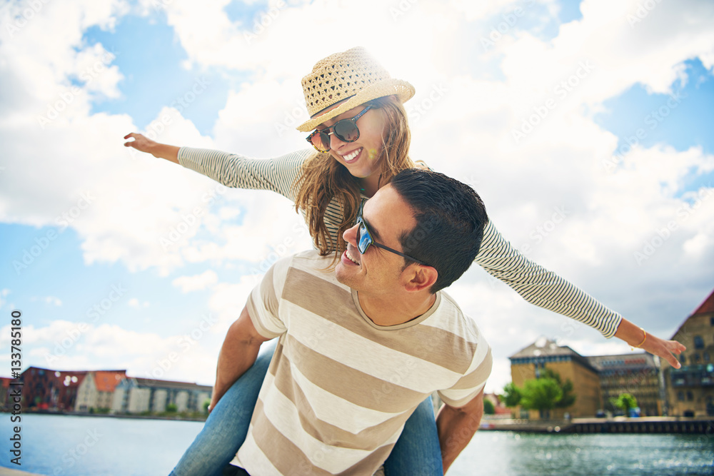 Happy young couple enjoying the summer sun