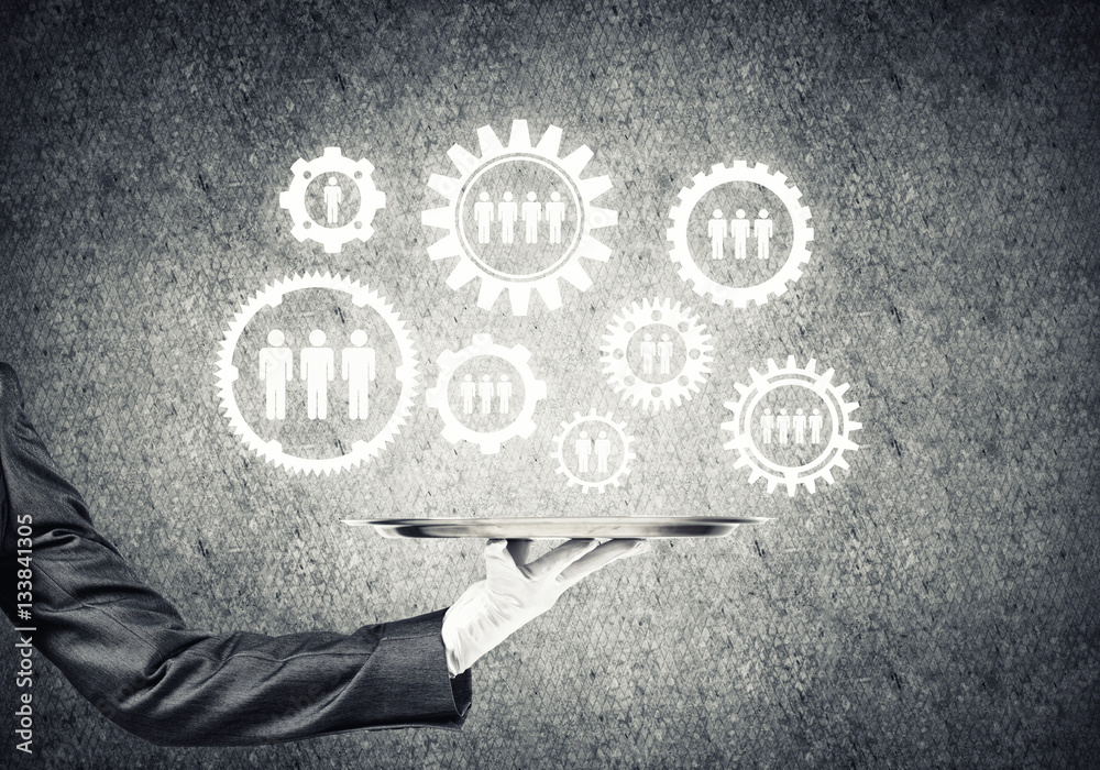 Waiter hand with white gloves holding silver plate full of social media communication icons