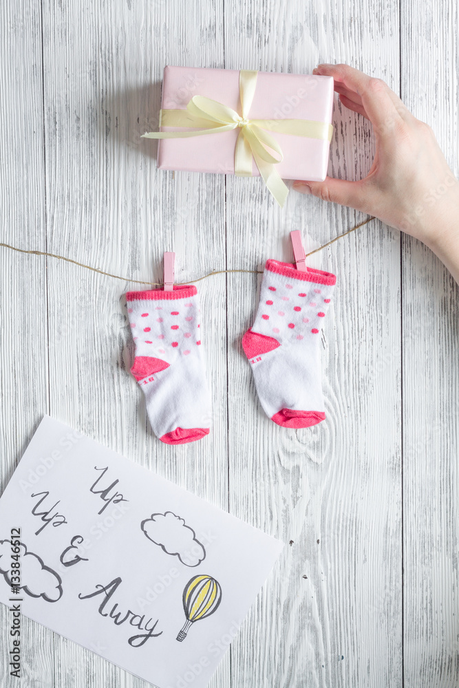 birth of girl - baby shower concept on wooden background