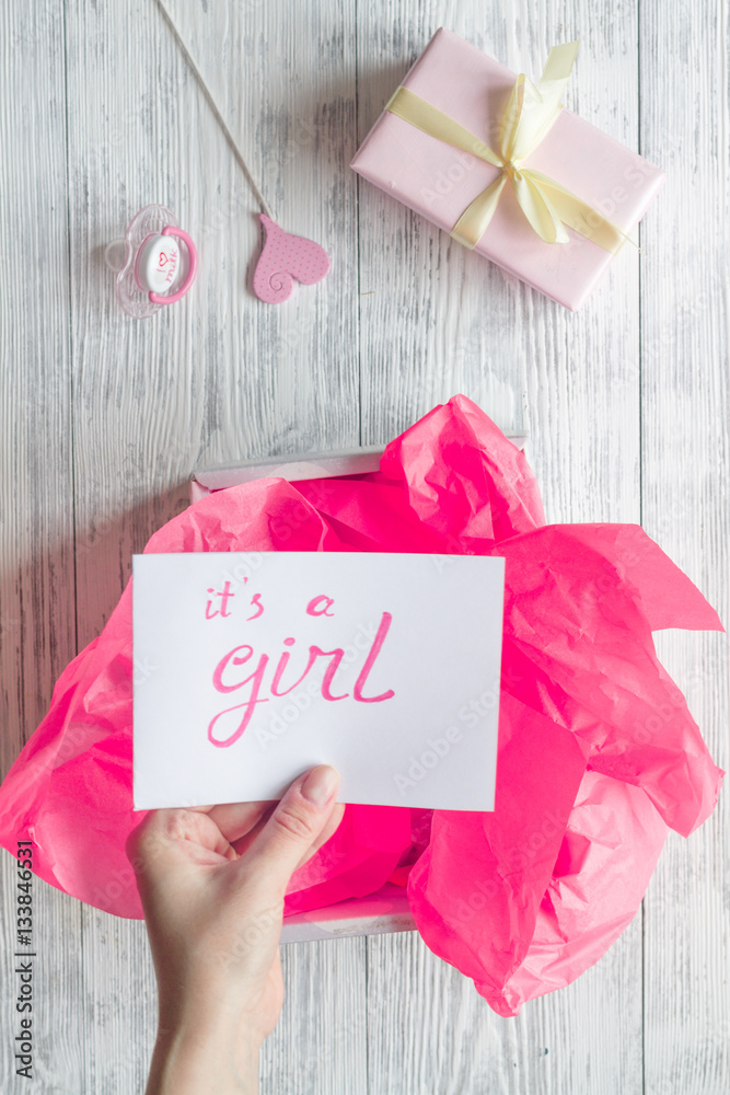 birth of girl - baby shower concept on wooden background