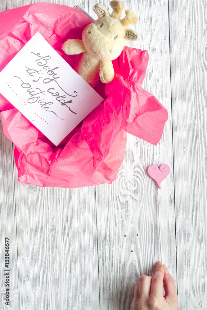 birth of girl - baby shower concept on wooden background