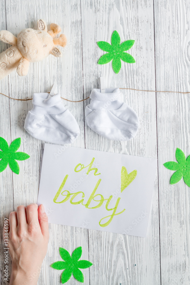 birth of child - baby shower concept on wooden background