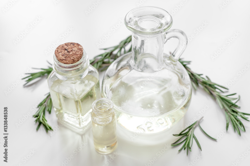 organic cosmetics with extracts of herbs rosemary on white background