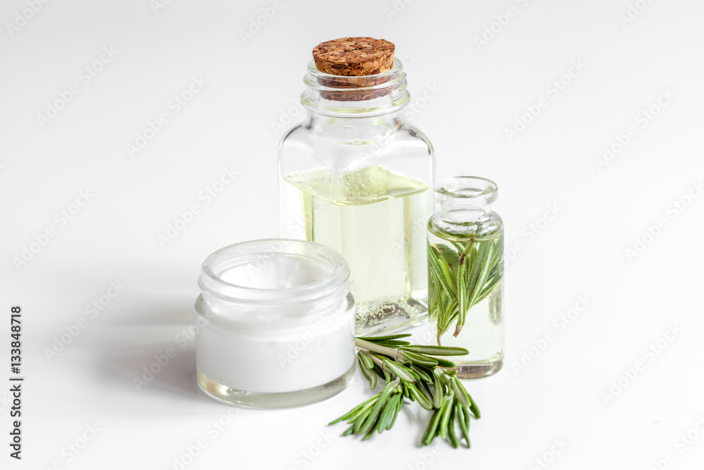 organic cosmetics with extracts of herbs rosemary on white background