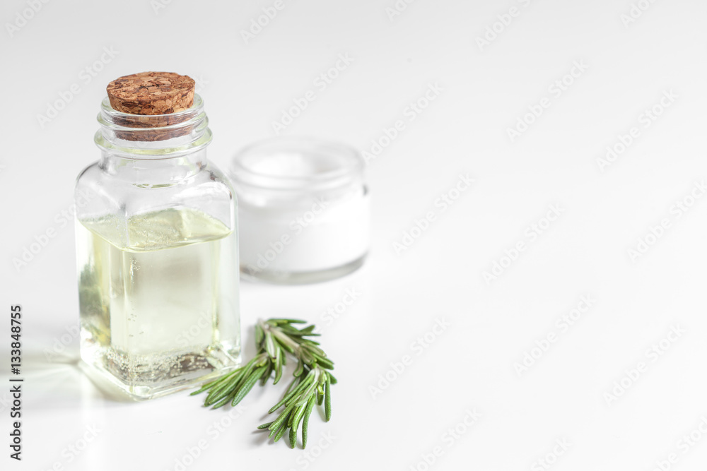 organic cosmetics with extracts of herbs rosemary on white background