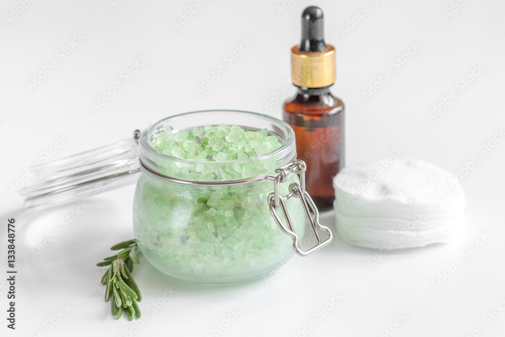 organic cosmetics with extracts of herbs rosemary on white background