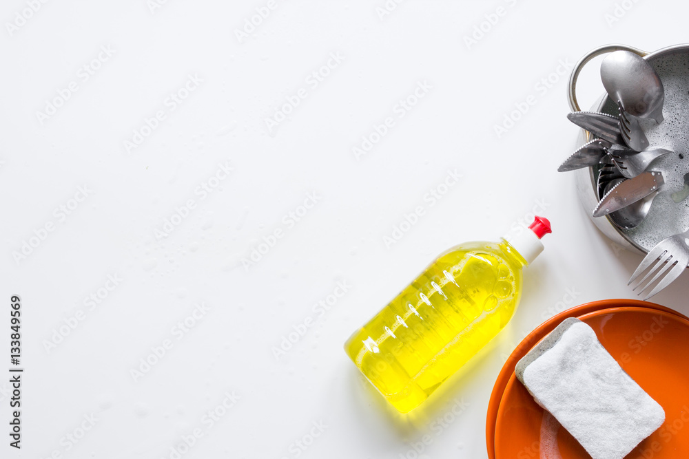 concept of washing dishes on white background top view