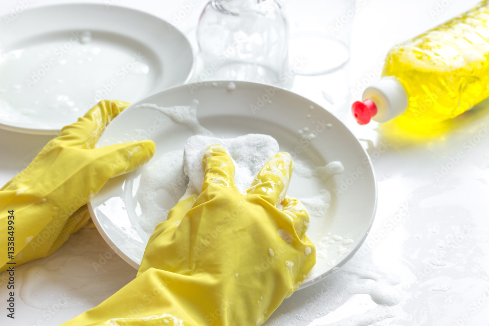 concept of woman washing dishes on white background