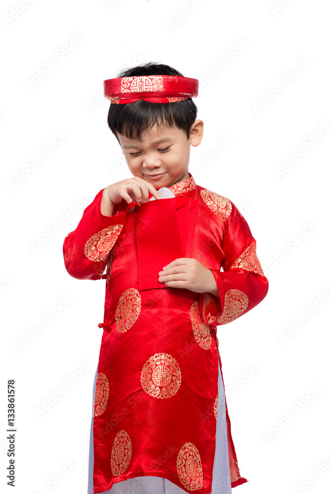 Little Vietnamese boy holding red envelops for Tet. The word mea