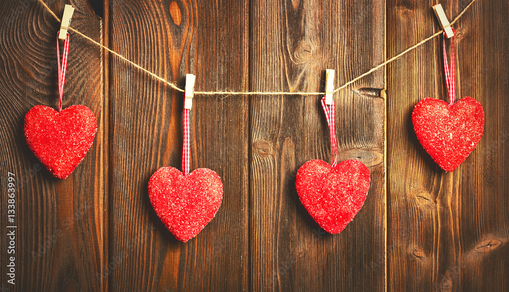 background of  Valentines Day. red hearts on wooden.