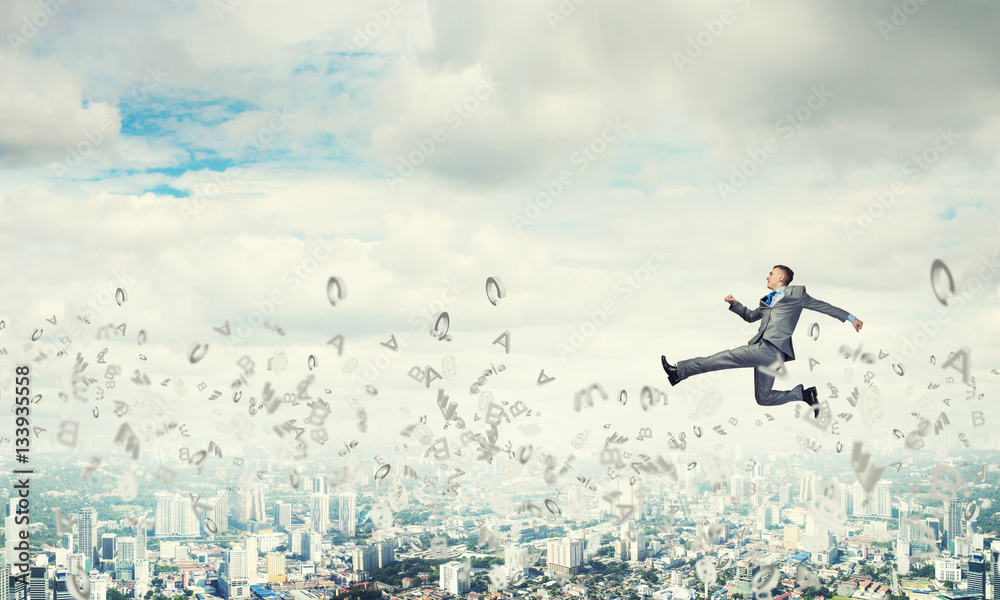 Businessman jumping high