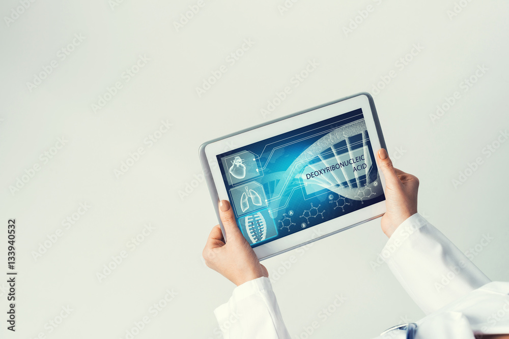 Close of female doctor hands working with tablet pc computer