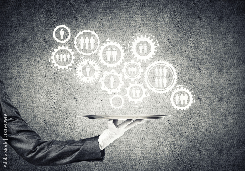 Waiter hand with white gloves holding silver plate full of social media communication icons