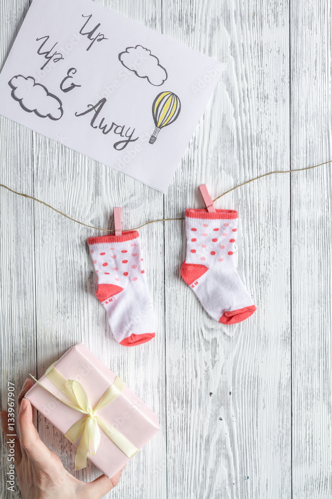 birth of girl - baby shower concept on wooden background