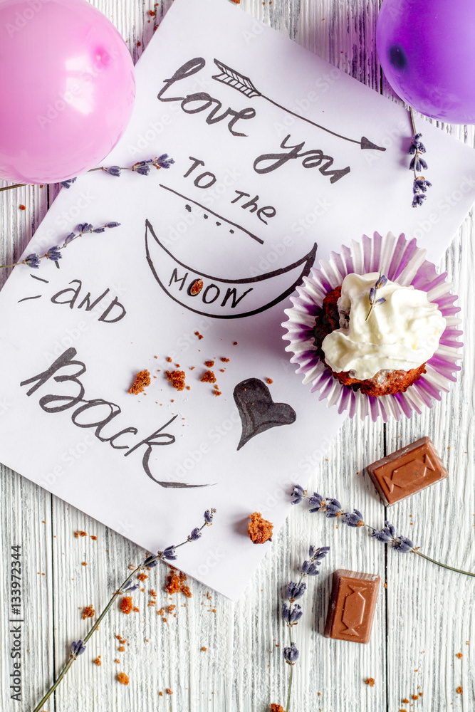 concept of Valentines Day cupcakes wooden background top view