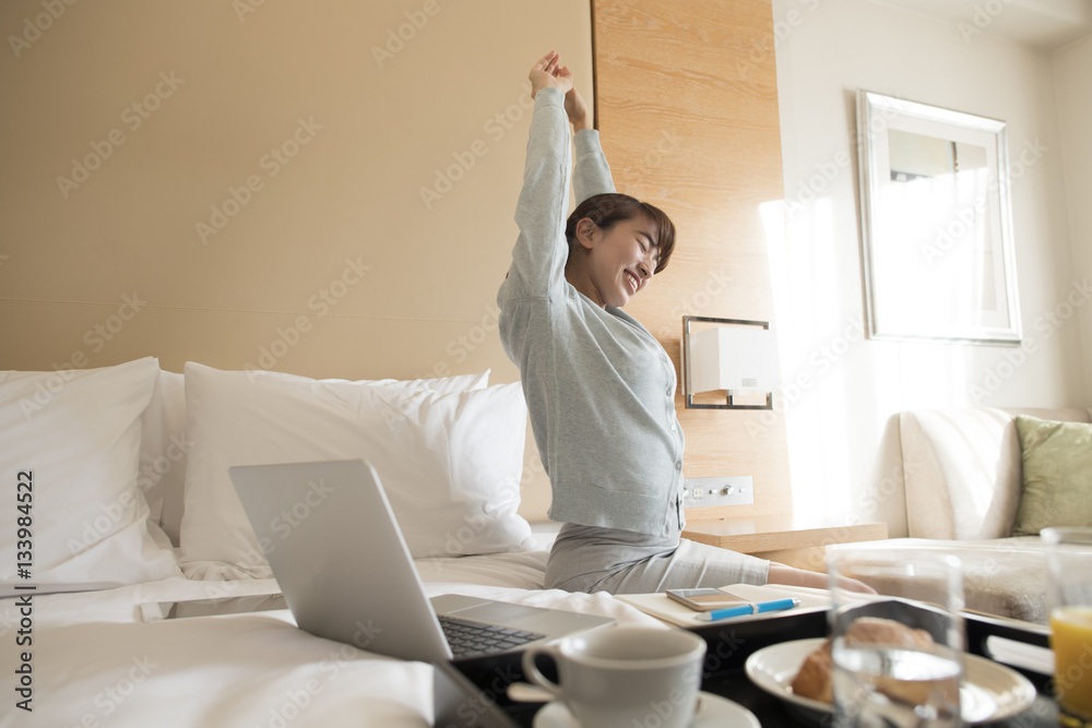 A young lady gets up and rises in the morning