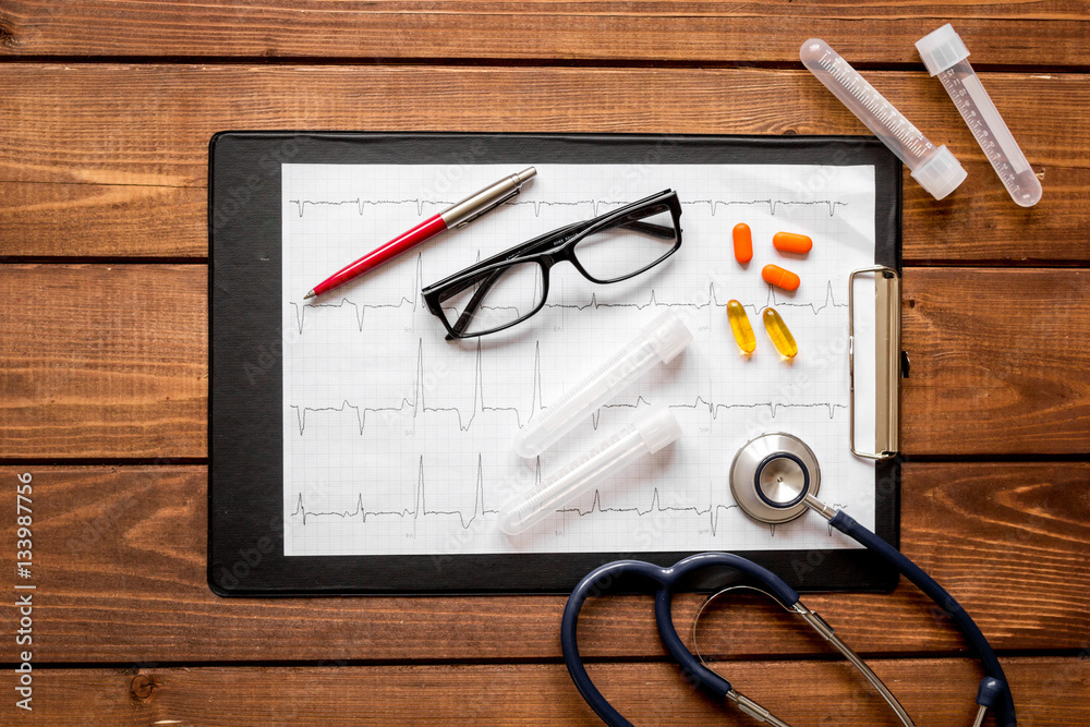 doctor workplace at wooden table in lab top view