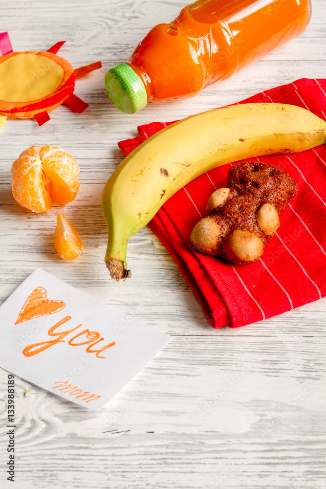 lunch box for kid with fresh vegetables on wooden background