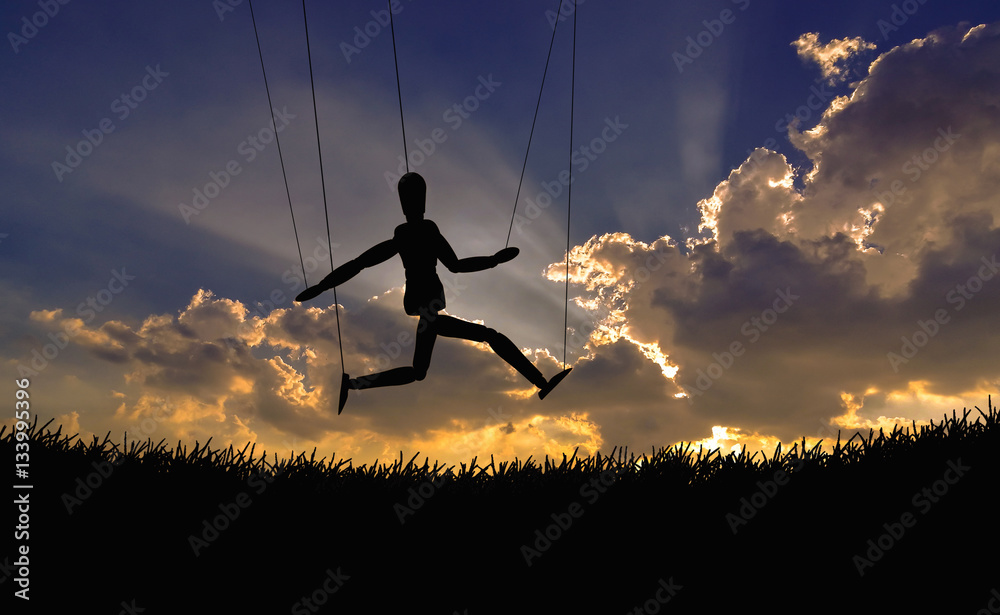 Silhouette of  doll  with sky in twilight time background