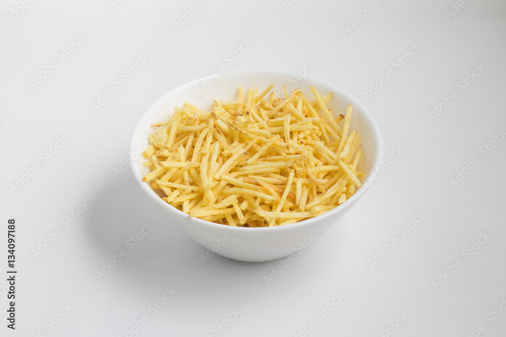 Potato Sticks into a bowl