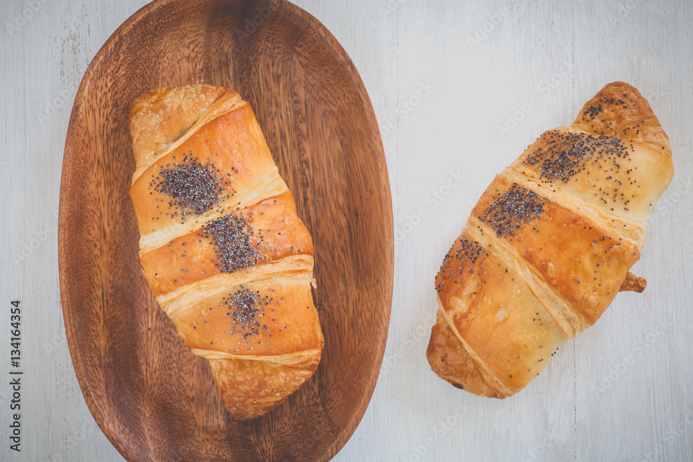 Fresh and tasty croissant over white background