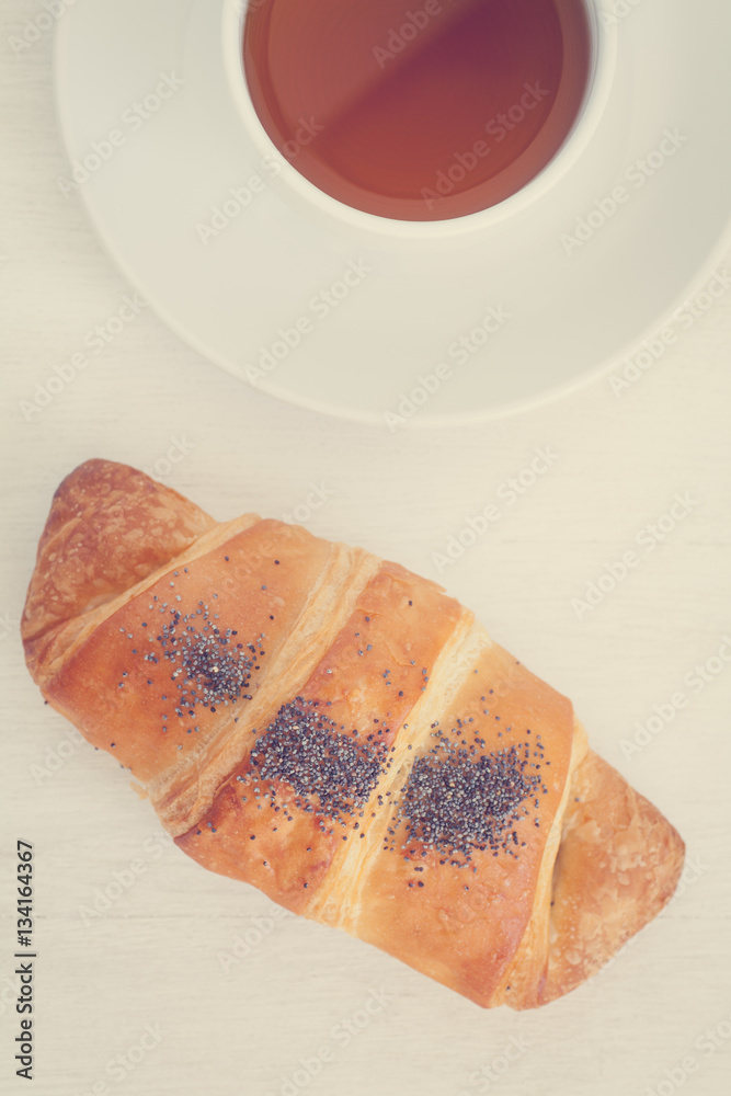 Fresh and tasty croissant over white background