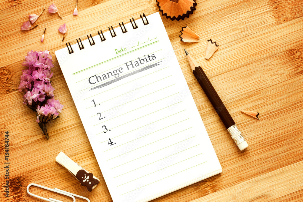 notepad with  pencil  on wooden table for change habits  list co