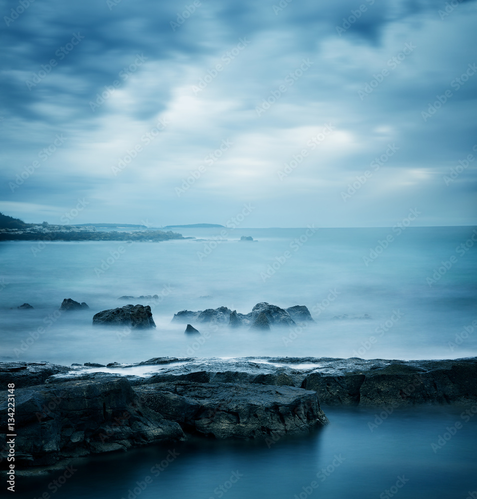 Peaceful Winter Seascape. Sea or Ocean with Dramatic Sky. Long Exposure. Calm Water and Moody Sky. C