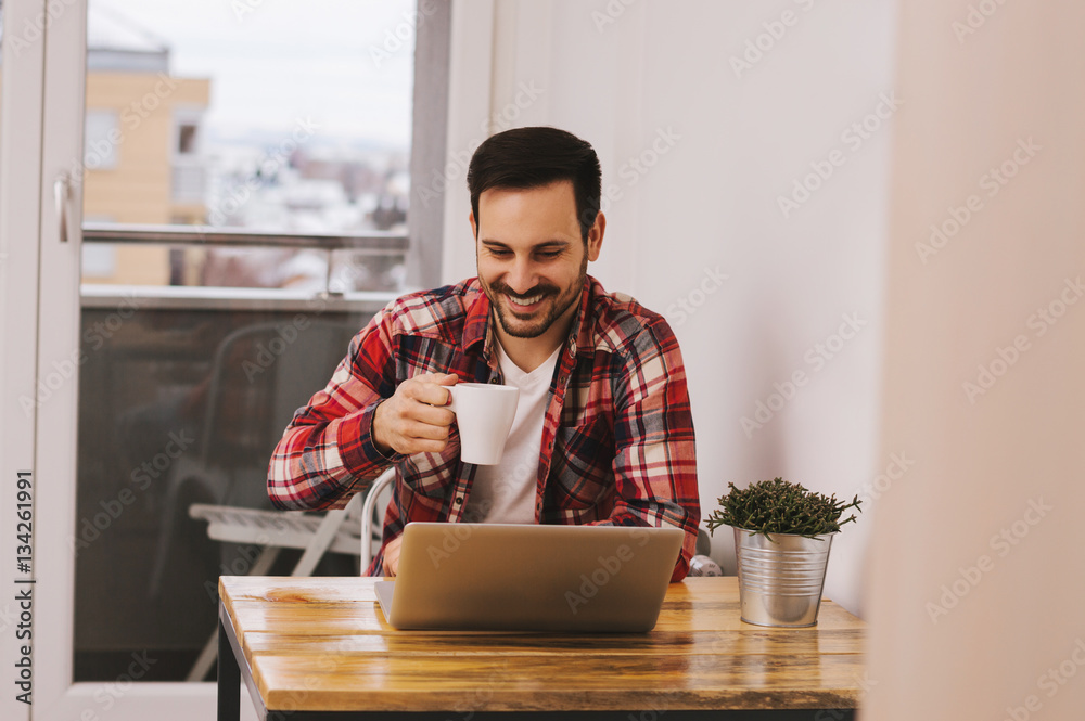 Portrait of handsome man drinking first morning coffee