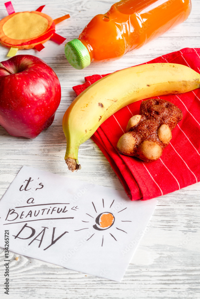 lunch box for kid with fresh vegetables on wooden background