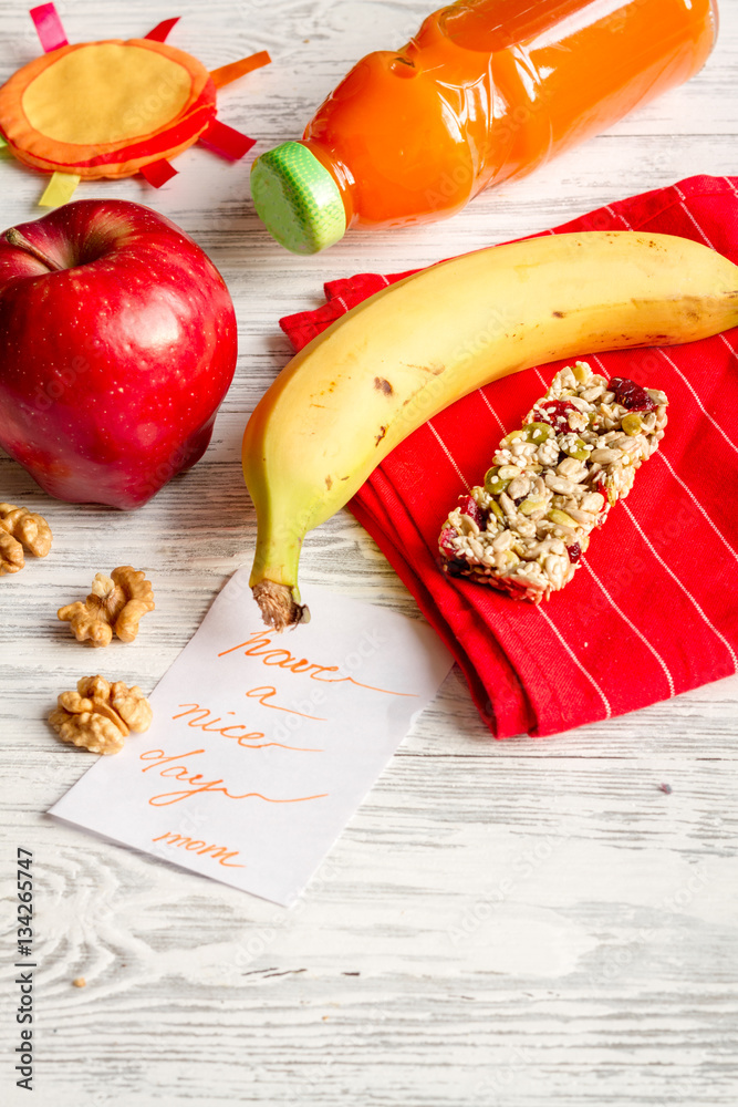 lunch box for kid with fresh vegetables on wooden background