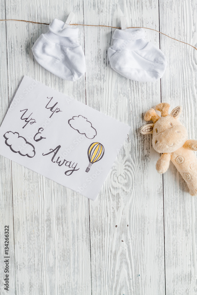 birth of child - baby shower concept on wooden background