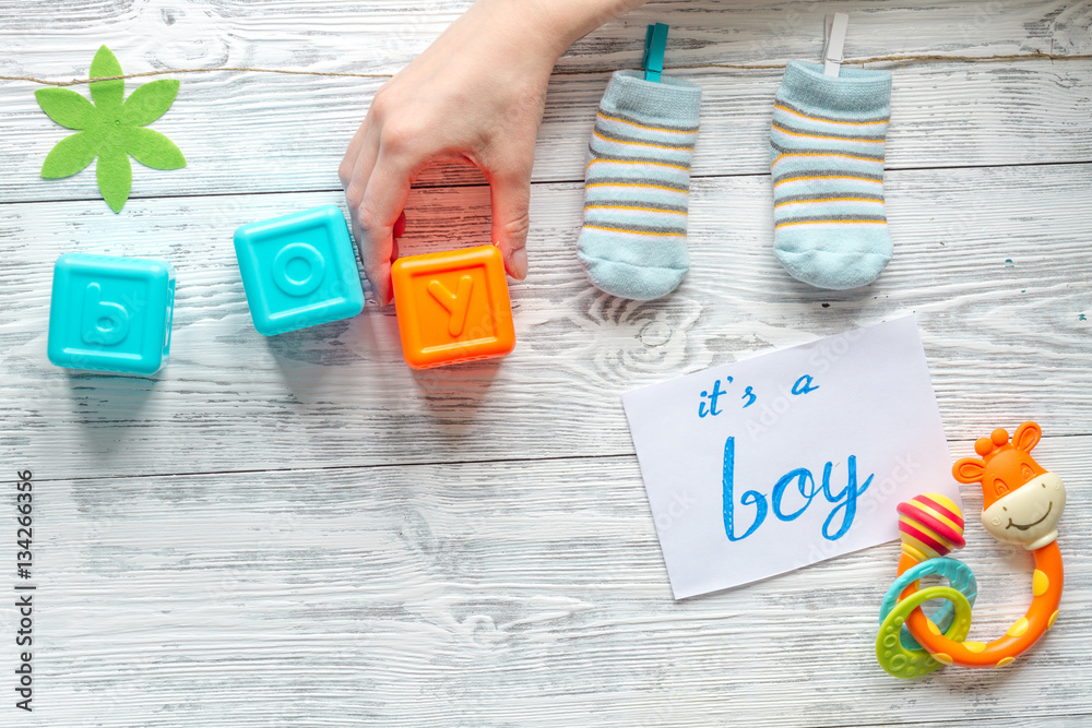 birth of boy - baby shower concept on wooden background