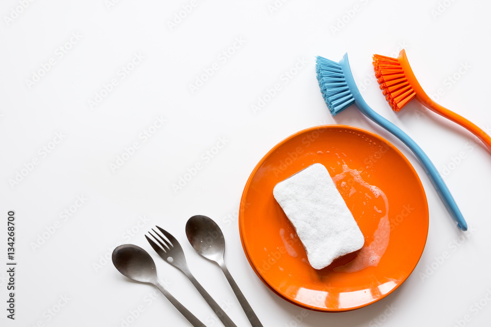 concept of washing dishes on white background top view