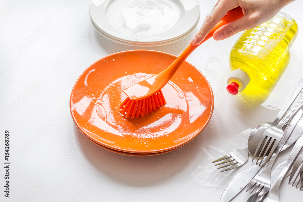 concept of washing dishes on white background