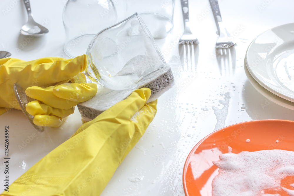 concept of woman washing dishes on white background