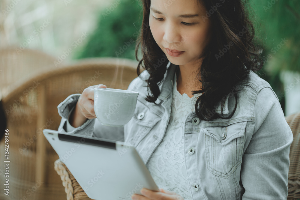 Happy business woman using a tablet computer