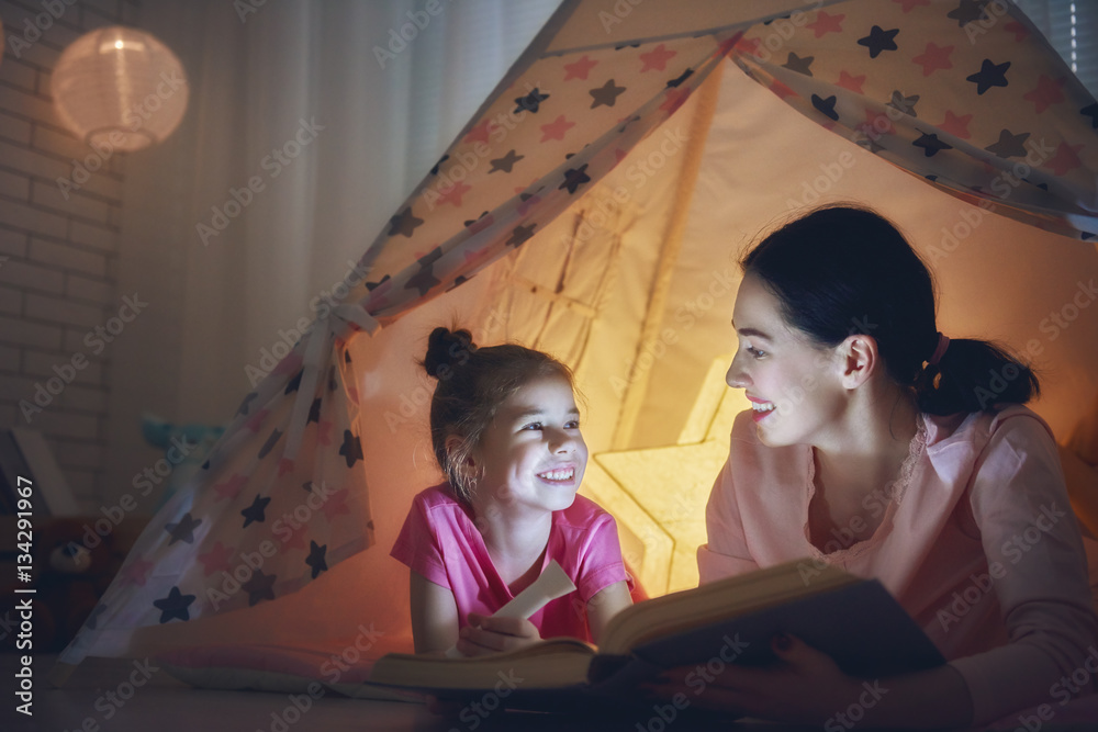 Mom and child are reading book