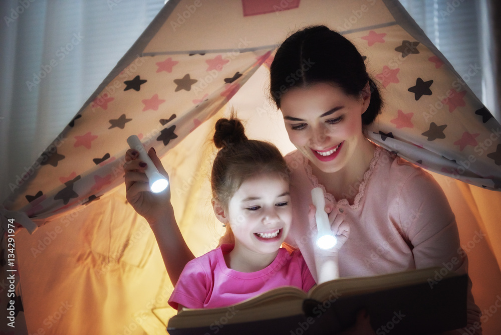 Mom and child are reading book