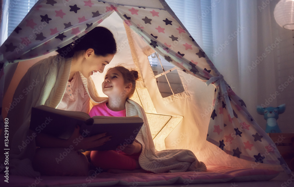 Mom and child are reading book