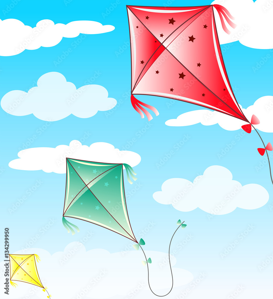 Three kites flying in blue sky