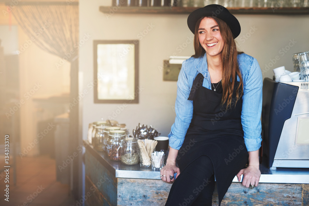 Young pretty female worker in?coffee shop