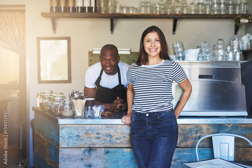 Two people posing at camera in?cafe