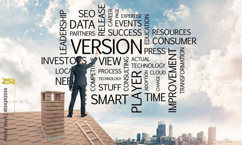 Young businessman standing on house roof and writing leadership 