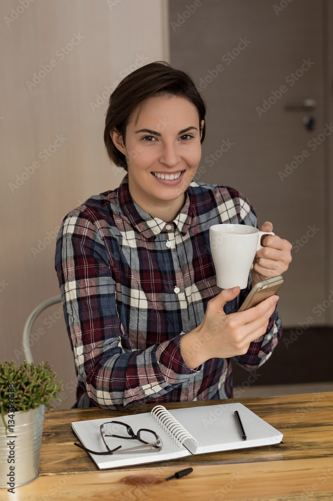 Portrait of a smiling student girl preparing for work