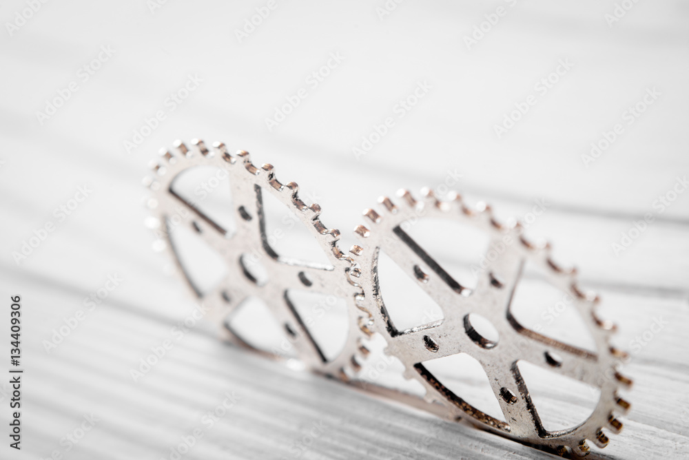 concept hour metal gears on wooden background top view