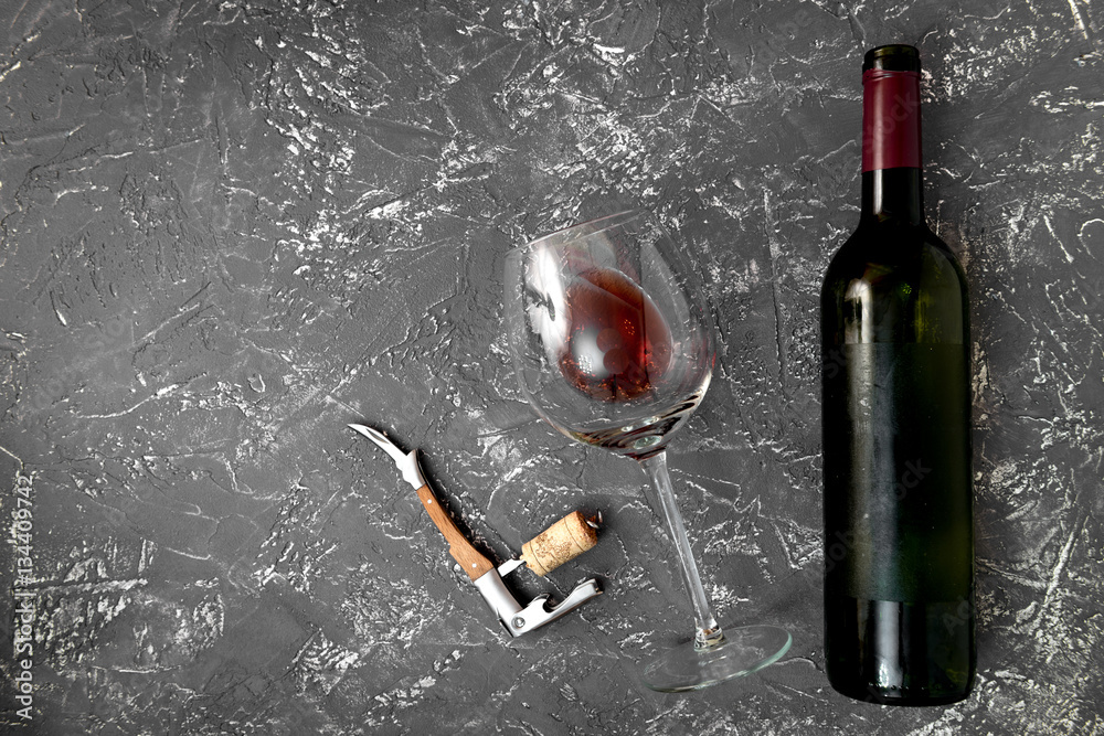 red wine with cheese on dark background top view